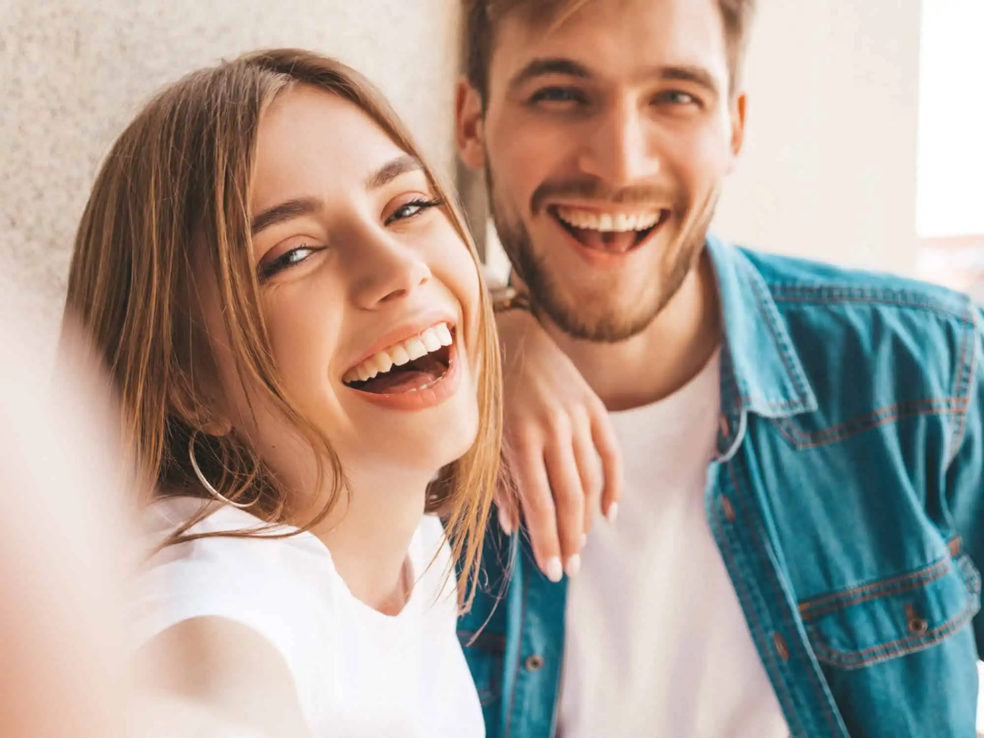 Happy couple filing their Swiss tax return online with Ditax